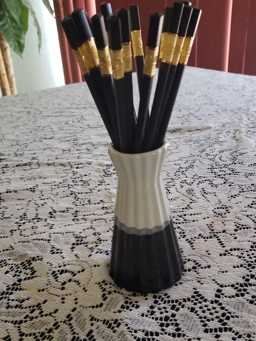 Elegant Chopsticks with Black and White Vase Container.
